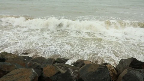 Walking on the seashore. Big waves. Windy cold day on the beach. Stormy day o Stock Footage 91446238