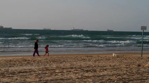 Walking on seashore Stock Footage 22534029