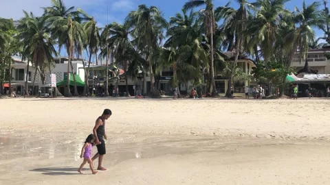 Walking at the seashore on a white sand beach Stock Footage 132210485