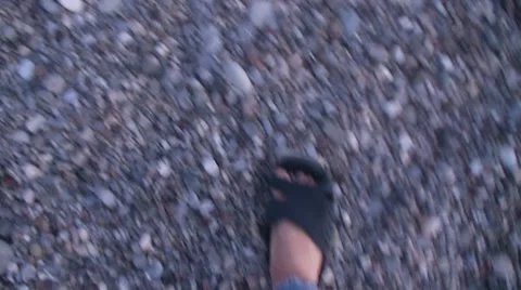 Walking on a shingly beach Stock Footage 8764590