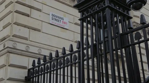 A walking shot of the downing street road sign, London, England, uk Stock Footage