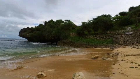 Walking on the side beach with the calm waves and white sand beach Video stock 166373495
