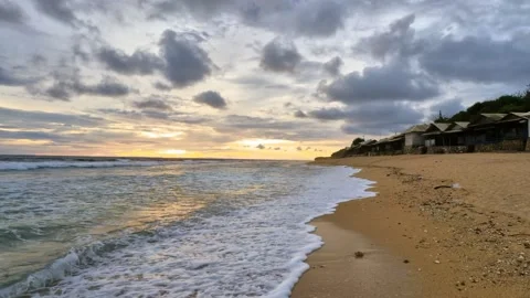 Walking on the side beach to the waves at sunset Video stock 166373597