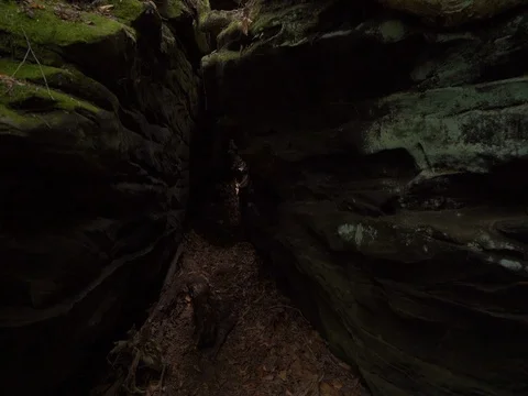 Walking into small cave inside rock Stock Footage 82733560