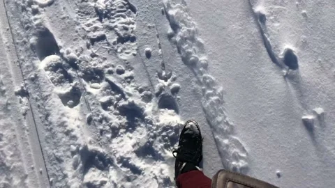 Walking in the snow in boots. The view from the top. Stock Footage 142085745