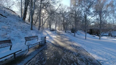 Walking in snow covered city park in the winter, pov Stock Footage 238726257