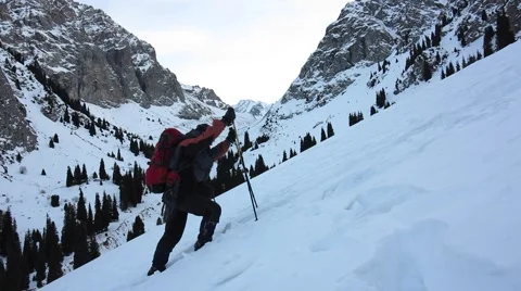Walking on snow-covered mountain Stock Footage 59679969