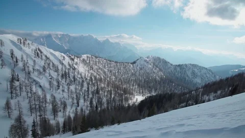 Walking up a snow mountain slope Stock Footage 102579149