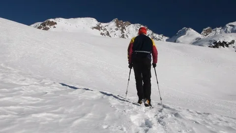 Walking with snowshoes in the mountains Stock Footage 122665324
