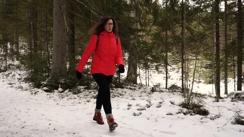 Walking in the snowy forest Видео 71650876