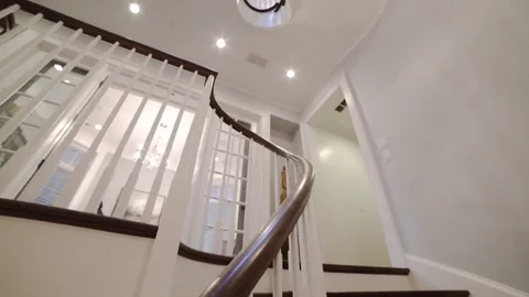 Walking up a spiral staircase Stock Footage