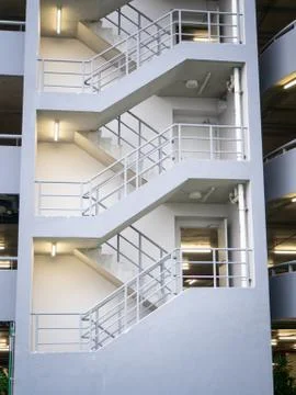 Walking stair on the side of a white multi storey parking lots building 写真素材