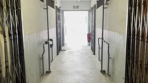 Walking to the staircase in corridor of Old public real estate in Kowloon Stock-Footage 152624019