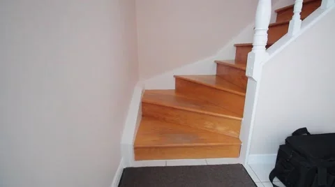 Walking up stairs inside house Stock Footage 60267572