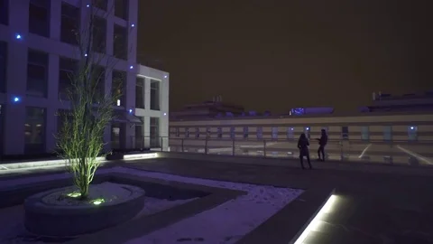 Walking with steadicam camera around night city block. Stock Footage 71017930