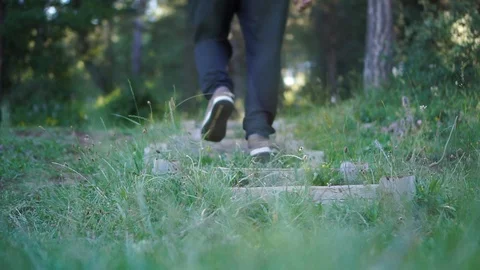 Walking on steps back in forest Stock Footage 92849761