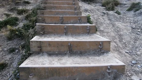 Walking up steps at the beach Stock Footage 91428930