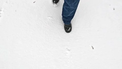 Walking steps on fresh snow during quiet winter day Stock Footage 322684127