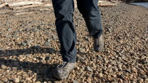 Walking on a Stone Beach 4K Stock Footage 150341627