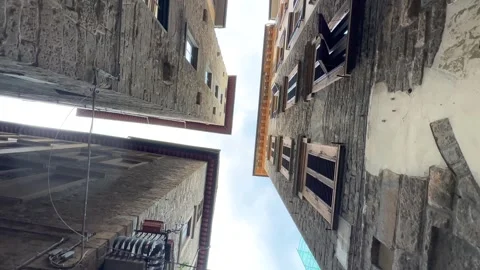 Walking in the street, between tall old buildings in Florence, Italy Stock Footage 242147241