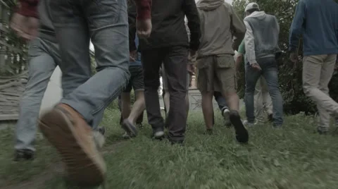 Walking street footbal hooligans going to legs foots backs Stock Footage 51729260