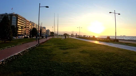 Walking a sunset in a park Pov Stock Footage 97972218
