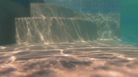 Walking into a swimming pool Stock Footage 534884