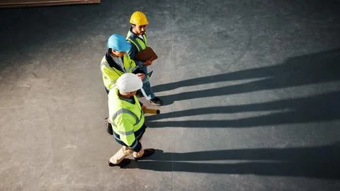 Walking, team and engineer with above people in building for inspection Stock Photos