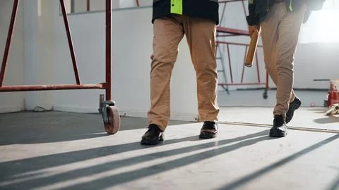Walking, team and engineer with legs of people in building for inspection Stock Photos