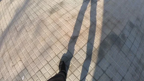 Walking on a Textured Pavement in Soft Light Stock Footage 314060240