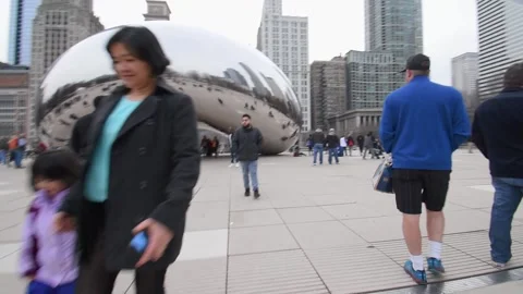 Walking though the Cloud Gate "the bean" at Millennium Park. Video stock 151553259