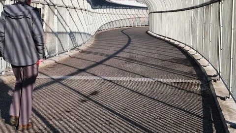Walking though graphic shadows Stock Footage 171132382