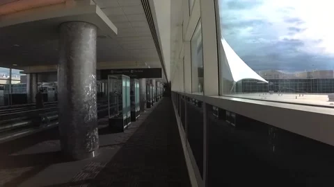 Walking through an airport between terminals Video stock 161206917