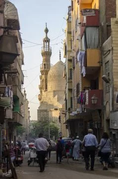 Walking through ancient Cairo near a Mamluk mosque Stock Photos