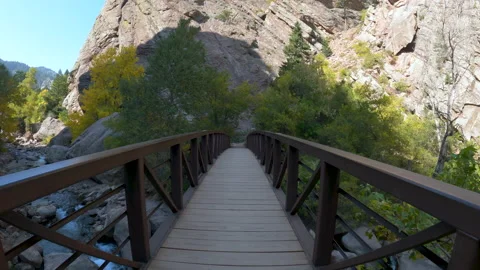 Walking through a bridge over a river Video stock 143869693