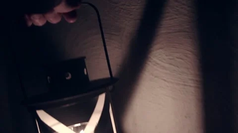 Walking through a building with a lantern. Stock Footage 68357135