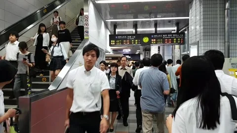 Walking through a busy Train Station in Tokyo Stock Footage 130998059