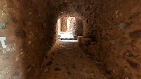Walking through the charming streets of Monemvasia, Greece, under clear skies an Video stock 301191105