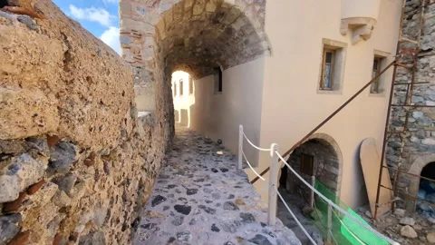 Walking through the charming streets of Monemvasia, Greece, under clear skies an Video stock 301191198