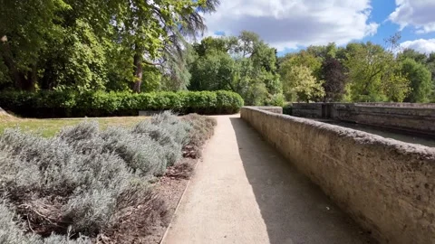 Walking through Château d'Azay-le-Rideau gardens in Loire Valley, passing 스톡 동영상 347983680