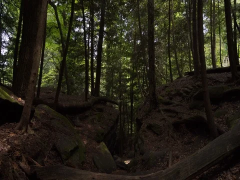 Walking through crevice between two large rock formations Stock Footage 82734029