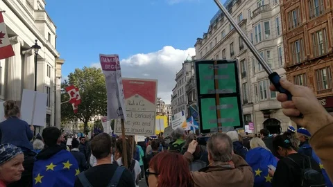 WALKING THROUGH THE CROWD IN PROTEST RALLY AGAINST BREXIT UK 4K Stock Footage 118278028
