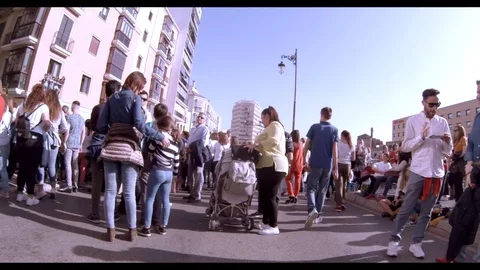 Walking through the crowd on a street during an outdoor event or parade Stock Footage 107443470
