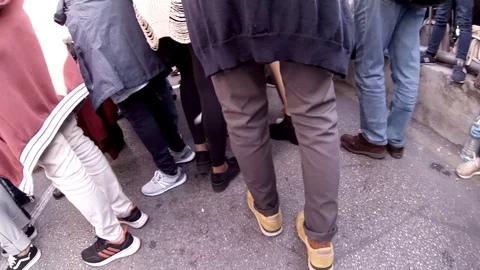 Walking through the crowd on a street during an outdoor event or parade Video stock 107941738