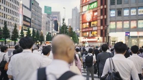 Walking through the crowded pedestrian crossing in the rush hour. Tokyo, Japan Stock Footage 126711566