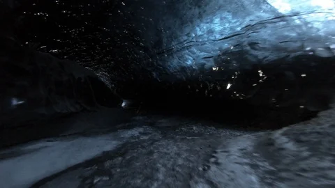 Walking through dark ice caves in Iceland glacier Stock Footage 122294969