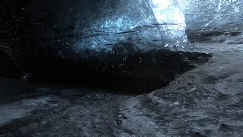 Walking through dark ice caves in Iceland glacier Stock Footage 122295034