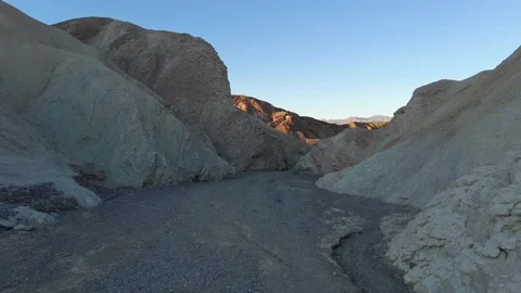 Walking through the Deep Sedimentary Wash at Zabriskie Point Stock Footage 330980509