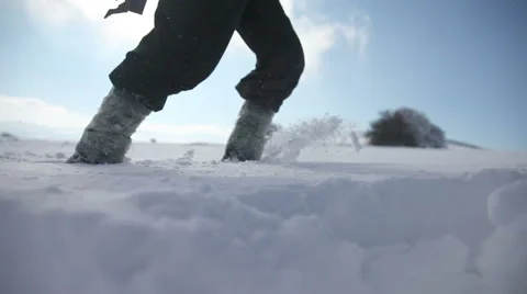 Walking through the deep snow Video stock 62950084