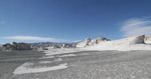 Walking through desertic region of grey sands and white pumice rocks 스톡 동영상 103484572